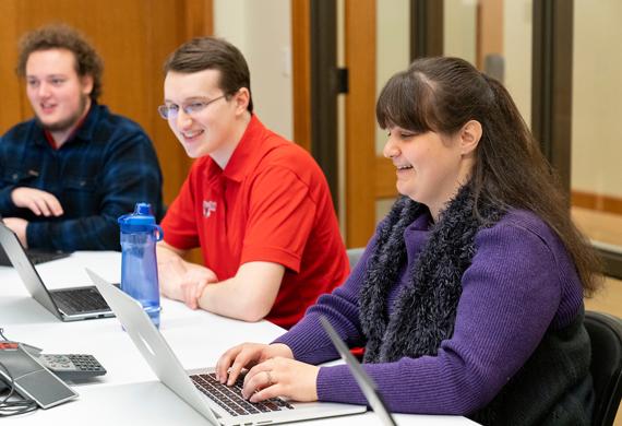 Image of female student working at a computer. 